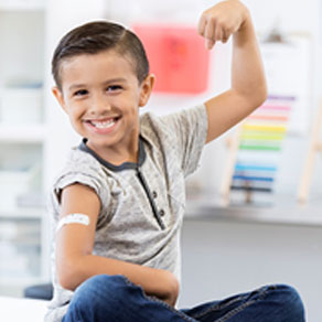 a young boy showing off his muscles 