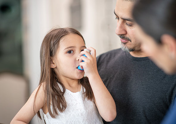 Little girl with inhaler