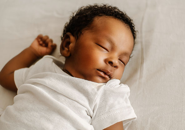 Black newborn baby sleeping