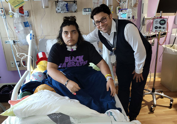 boy on hospital bed with doctor by his side