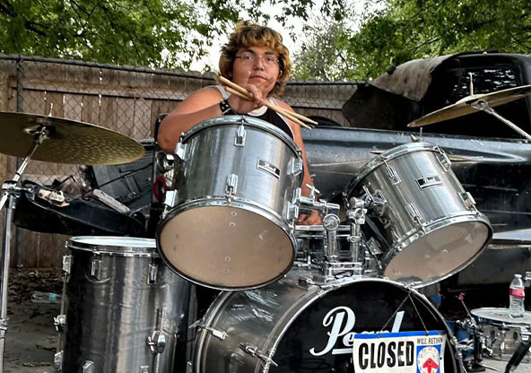 boy playing drums
