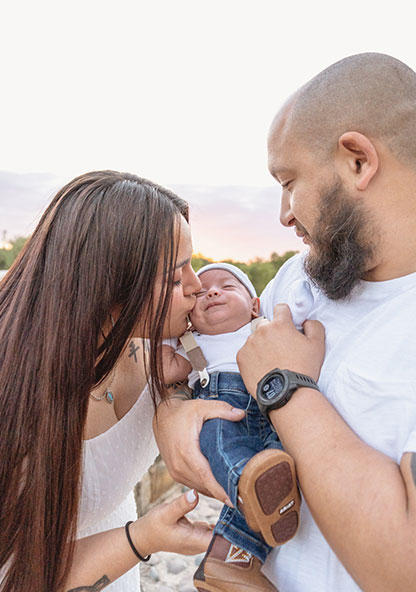 Mother kissing baby henry