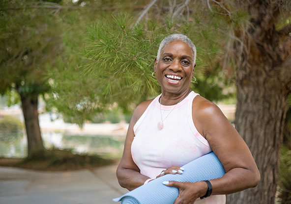 A woman practicing self care for better breast health