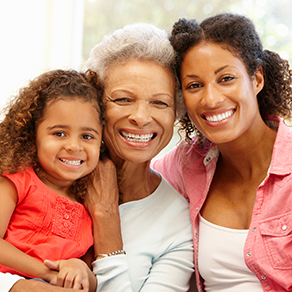 Three generations of women smiling 