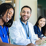 Three physicians smiling