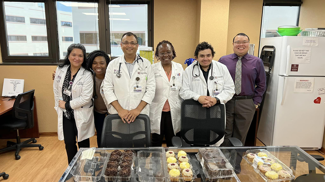 Residents during clinic with donuts