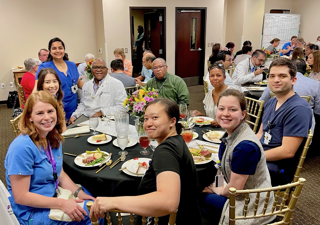 A group of CHRISTUS Santa Rosa residents eating together