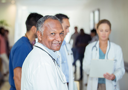 Doctor smiling in hallway