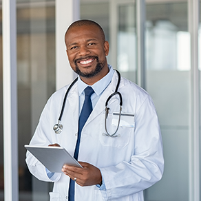An African-American male doctor smiling