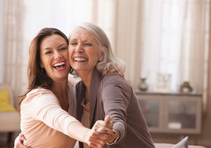 A elder lady and her daughter dancing