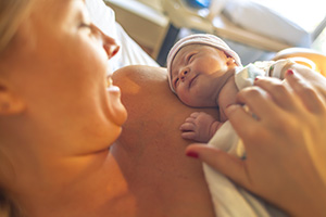 White mom and newborn baby having skin to skin at the hospital