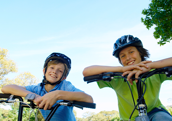 10 year old boys riding a bike