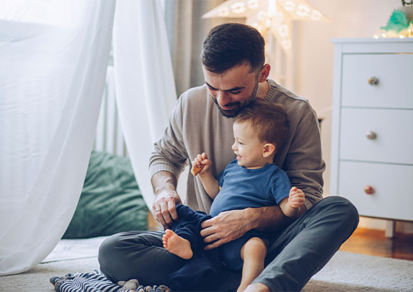 A father and son in a playroom