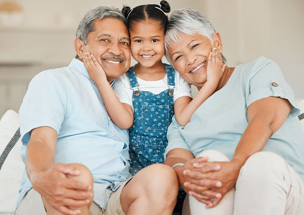 Hispanic grandparents with their granddaughter