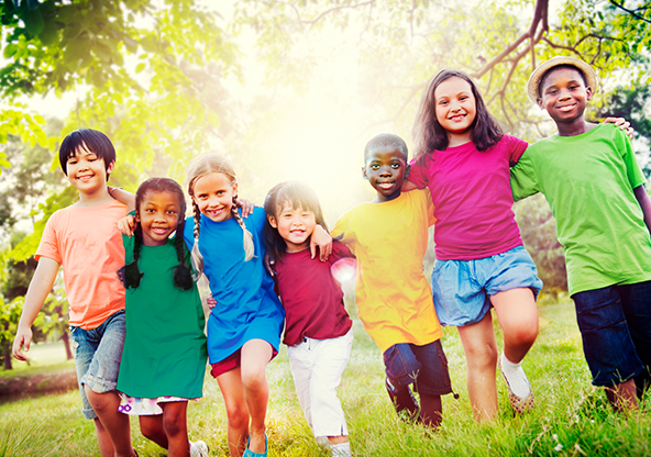 A group of children walking outside together