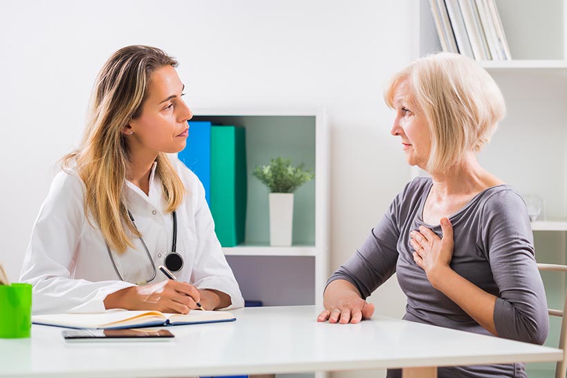 Patient telling doctor about her adult congenital heart disease