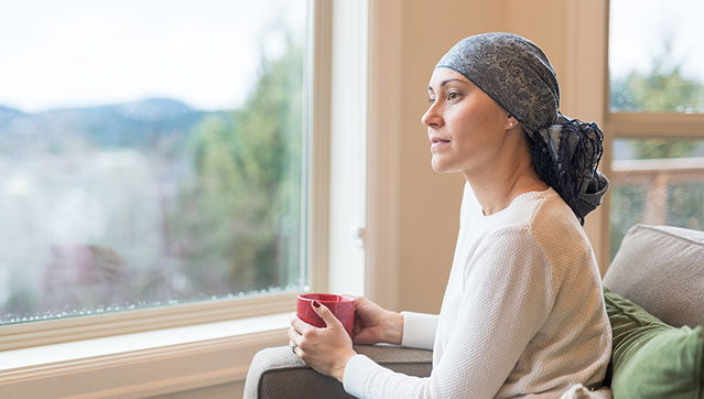 Beautiful mixed race mother and daughter relaxing outdoors together