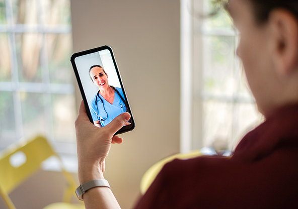 A man talking to a physician through the on demand virtual service for his medical emergency