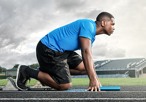 Athlete preparing to run on a track