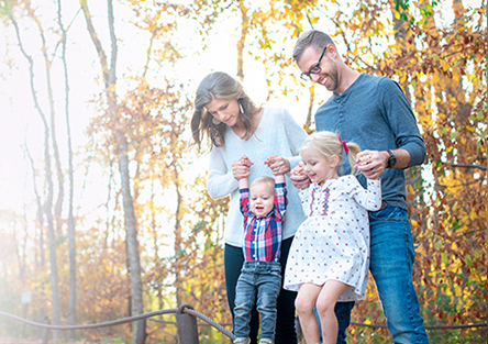 Young family playing outside